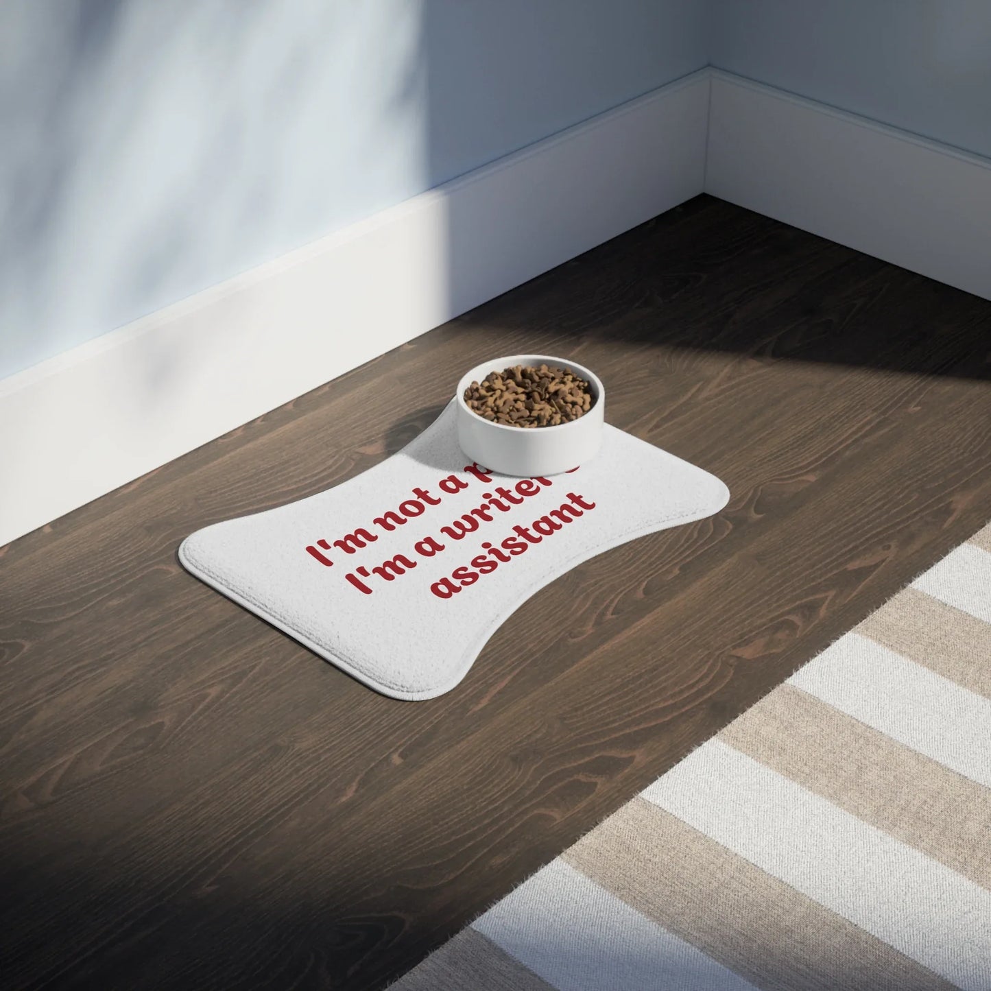 Funny Pet Feeding Mat - "I'm Not a Pet, I'm a Writer's Assistant" - The Dreamer's Bookshop.