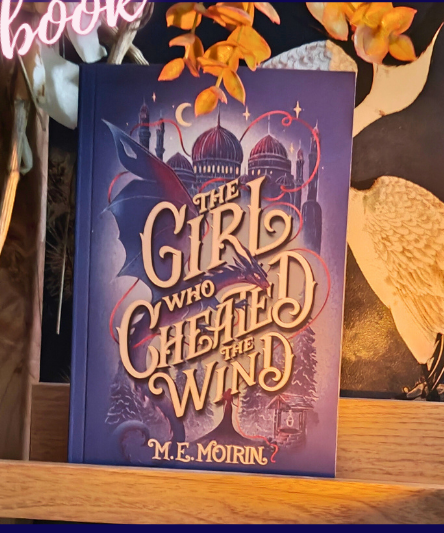 One book cover:The Girl who cheated the wind.