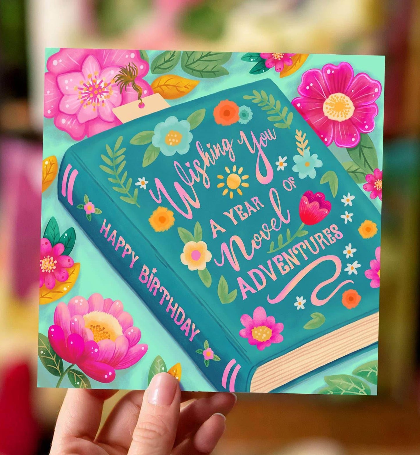 Aniet Illustration - Kaart felicitatie verjaardag boek blauw met bloemen vrolijk - The Dreamer's Bookshop.